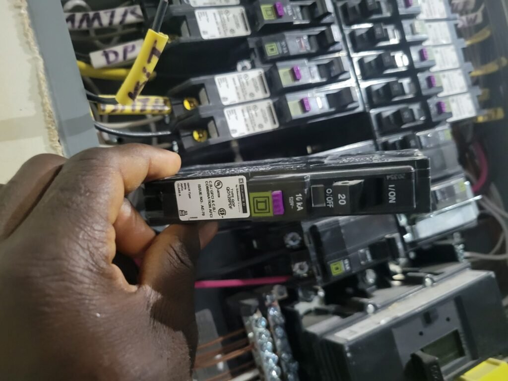 Electrician installing a new AFCI/GFCI circuit breaker in a residential electrical panel in Crofton, MD