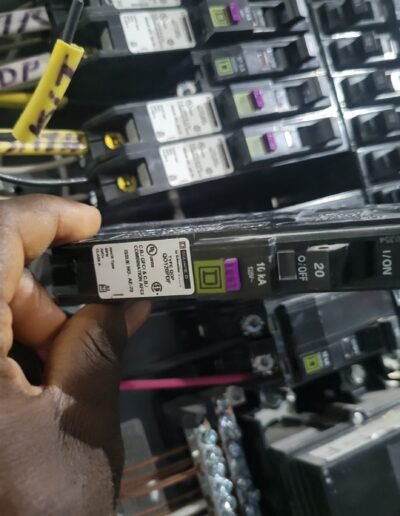 Electrician installing a new AFCI/GFCI circuit breaker in a residential electrical panel in Crofton, MD