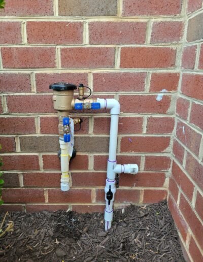 New backflow preventer installed on an outdoor water line in Severn, MD