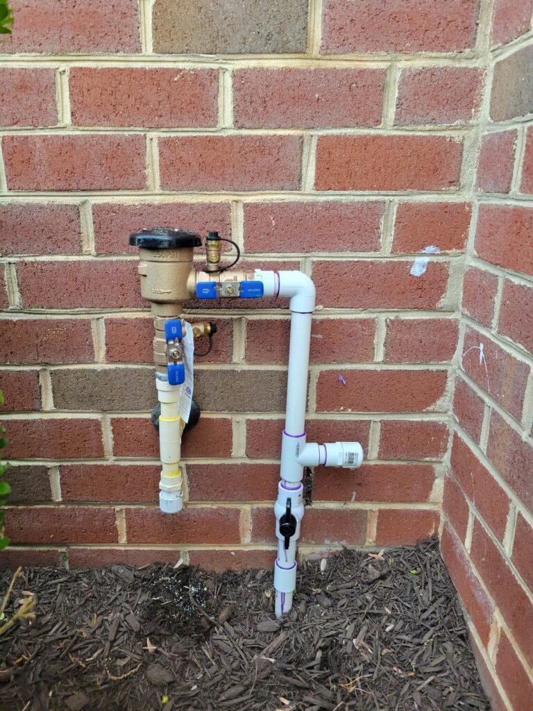 New backflow preventer installed on an outdoor water line in Severn, MD