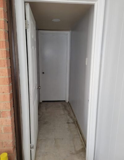 Basement hallway prepared for new bathroom plumbing in Upper Marlboro, MD