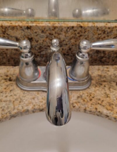 New chrome bathroom faucet on a granite vanity in Columbia, MD