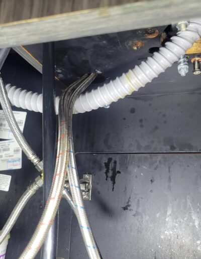 Bathroom sink drain plumbing under a vanity in Gaithersburg, MD