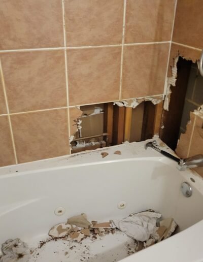 Bathtub wall opened to find a leak in Germantown, MD