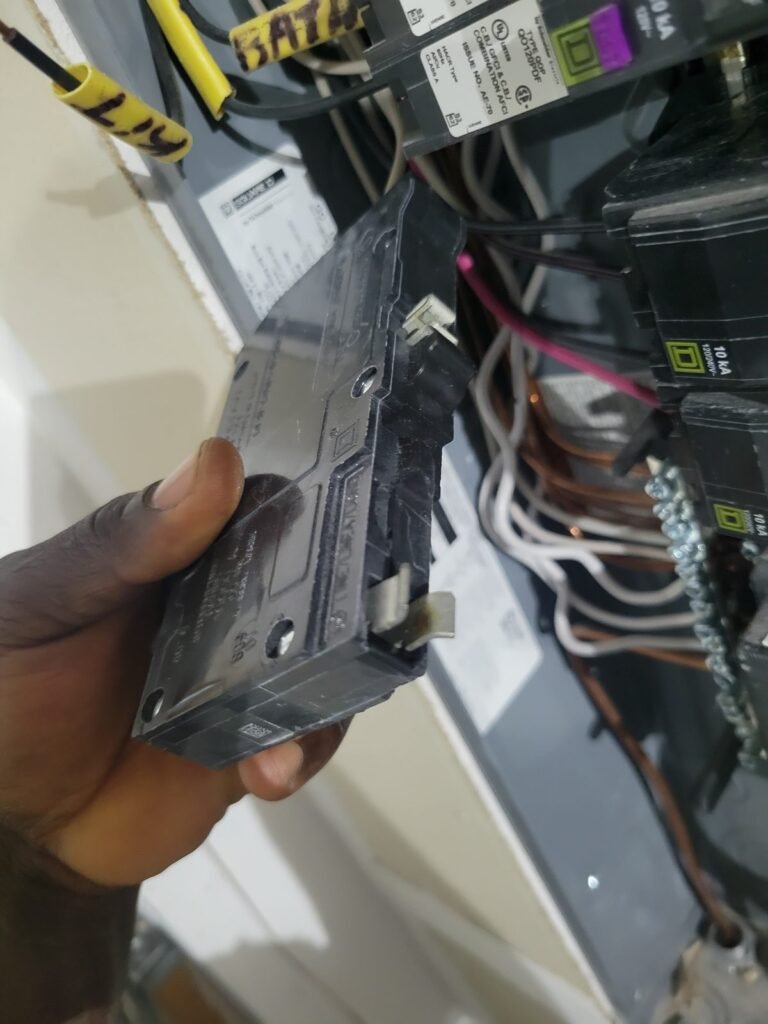 Electrician installing a new breaker in an electrical panel in Crofton, MD