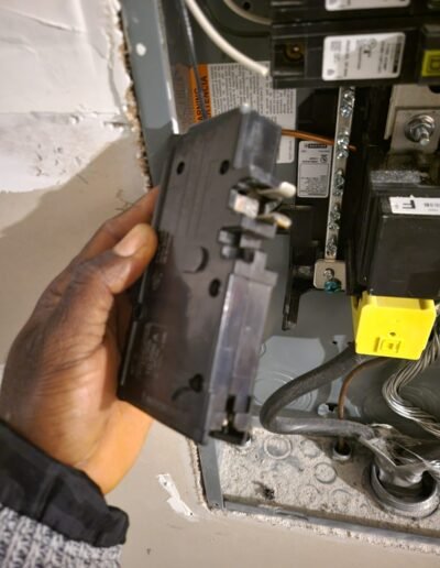 Electrician replacing a circuit breaker in a panel in Accokeek, MD