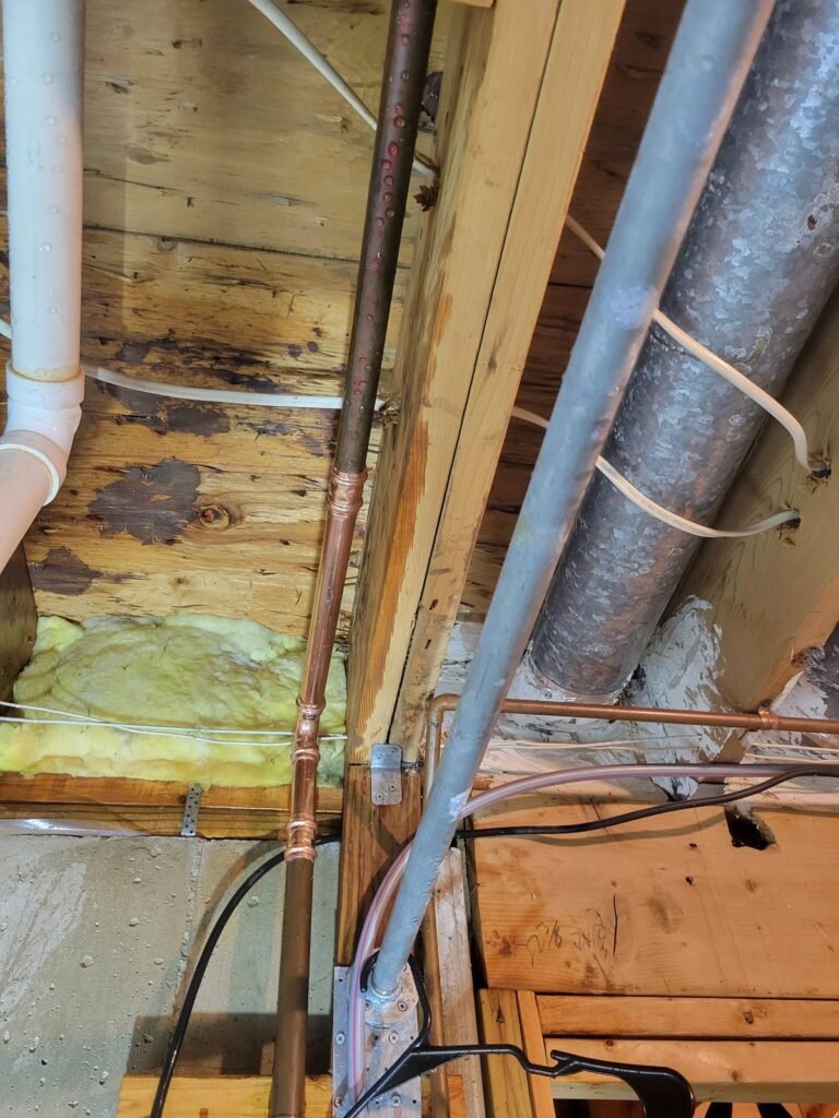 New copper water lines installed in a basement ceiling in Lanham, MD