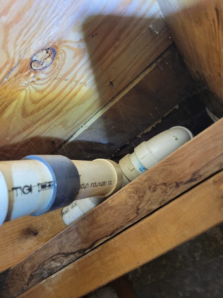 PVC drain pipe repair in a crawl space in Woodbridge, VA