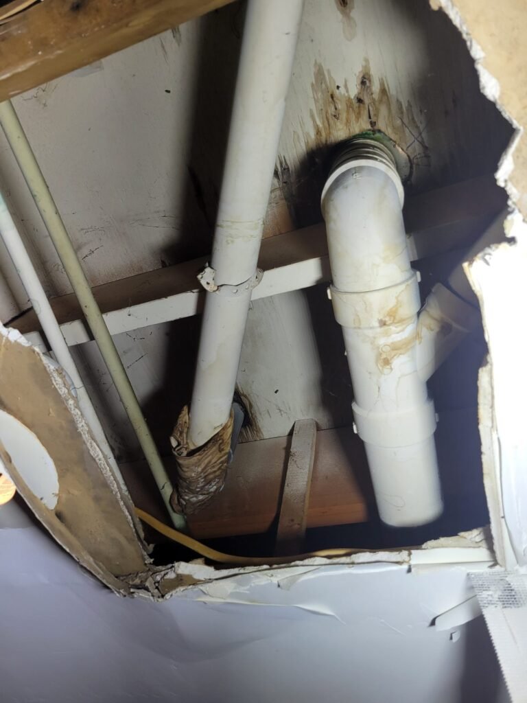 Leaking drain pipe found above a ceiling in Germantown, MD