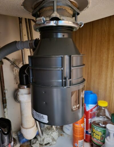 New garbage disposal installed under a kitchen sink in Laurel, MD