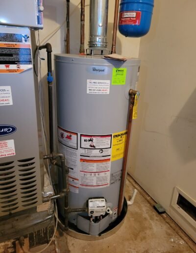 New gas water heater installed next to a furnace in Bowie, MD