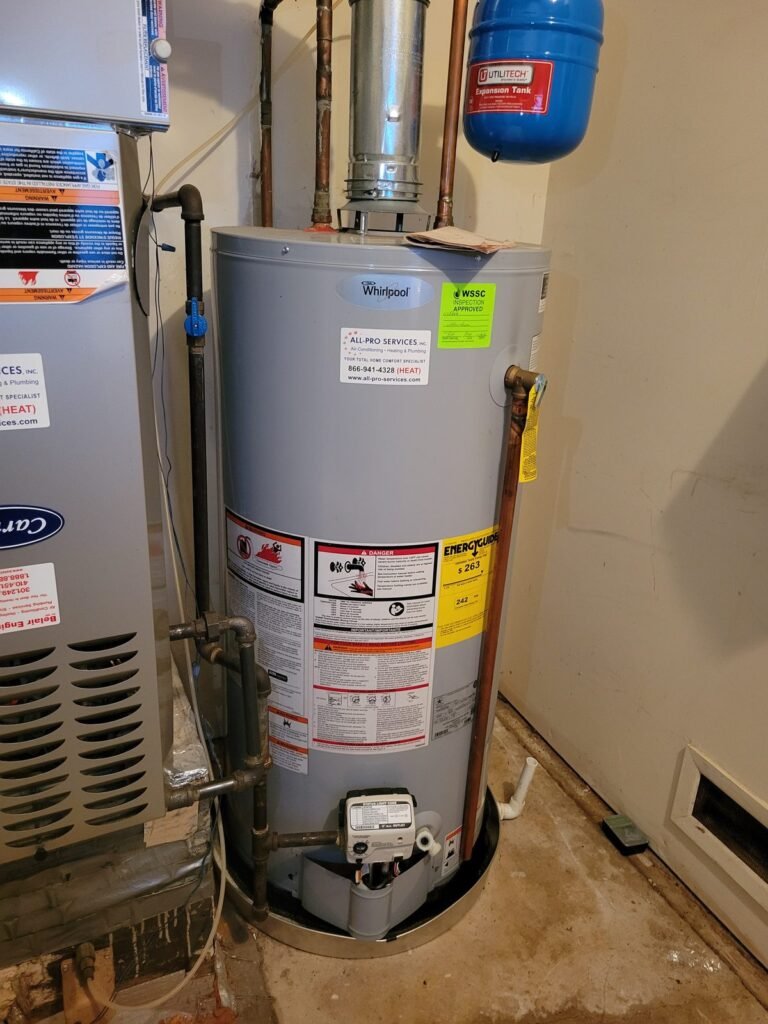 New gas water heater installed next to a furnace in Bowie, MD