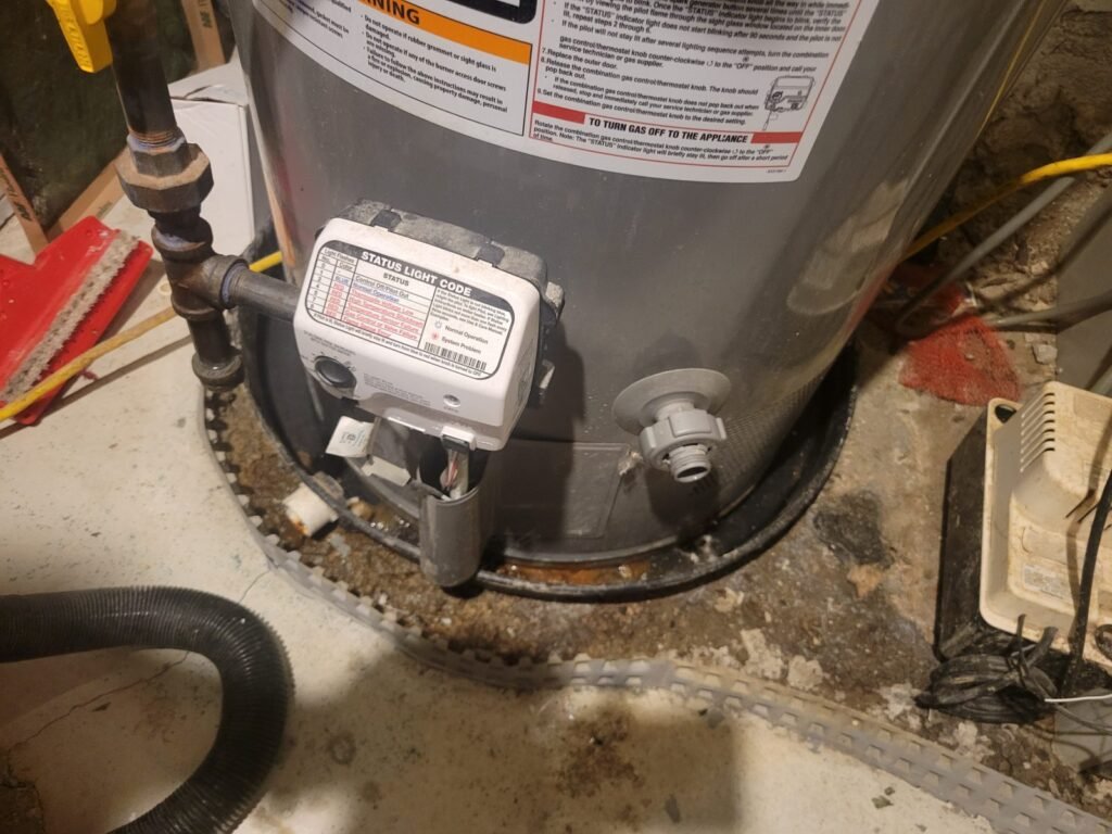 Gas water heater control valve and base during repair in Baltimore, MD