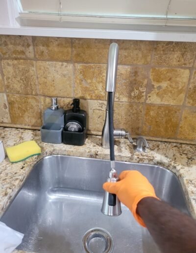Testing a newly installed kitchen faucet in Washington, DC