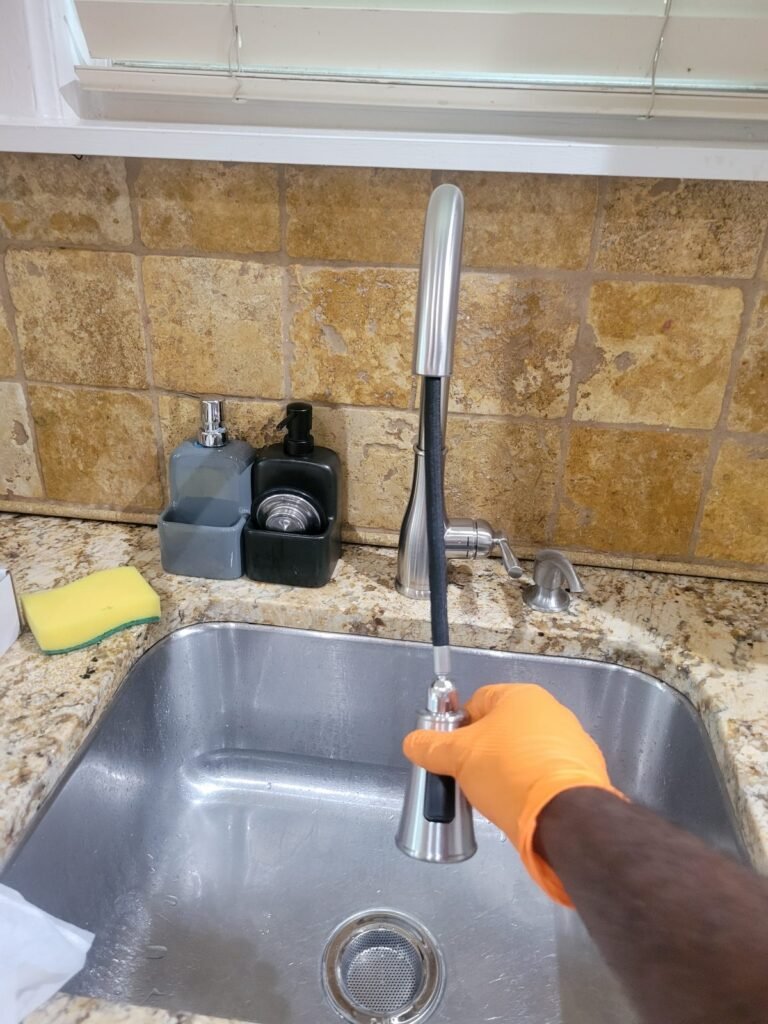 Testing a newly installed kitchen faucet in Washington, DC