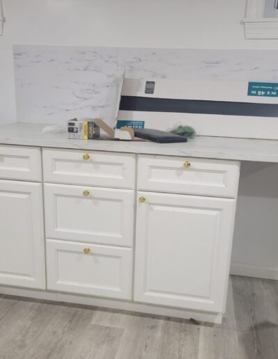 New kitchen sink base cabinet ready for plumbing in College Park, MD