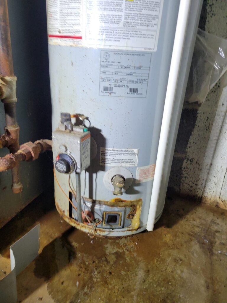 Leaking water heater with rust at the base in Seat Pleasant, MD