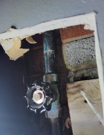Main water shut-off valve behind a wall access opening in Washington, DC
