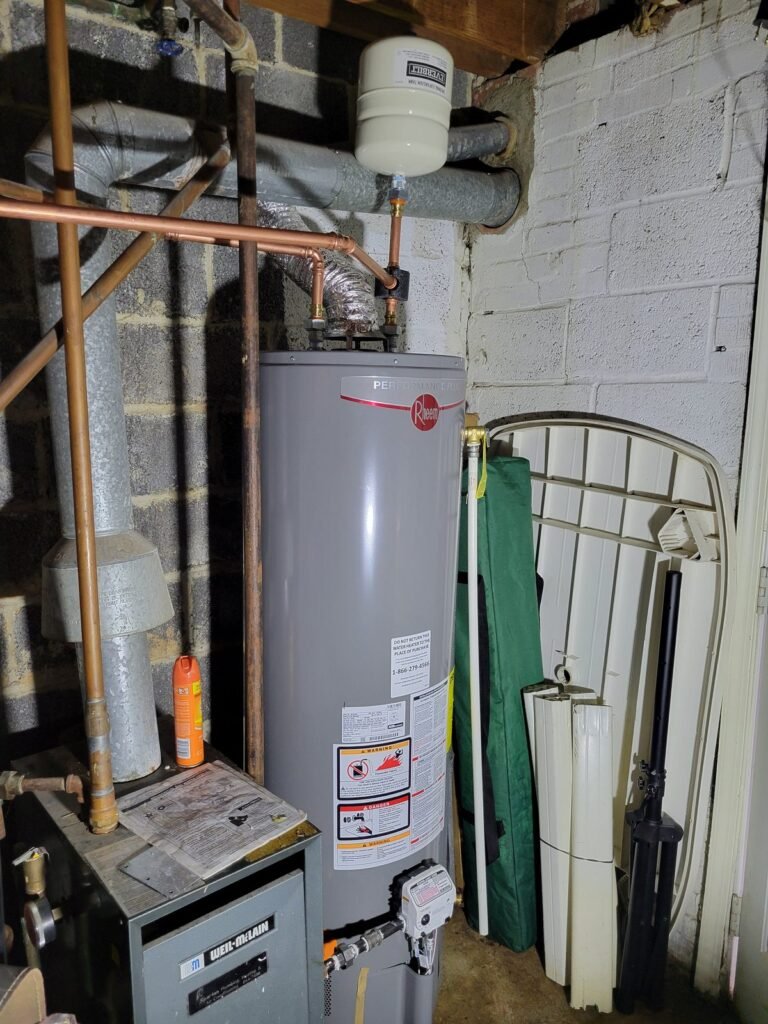 New Rheem gas water heater with expansion tank and copper piping installed in Seat Pleasant, MD