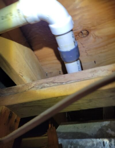 PVC drain line connection under floor joists in Woodbridge, VA