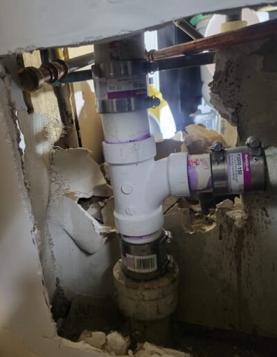 New PVC drain stack fittings installed in a wall in College Park, MD
