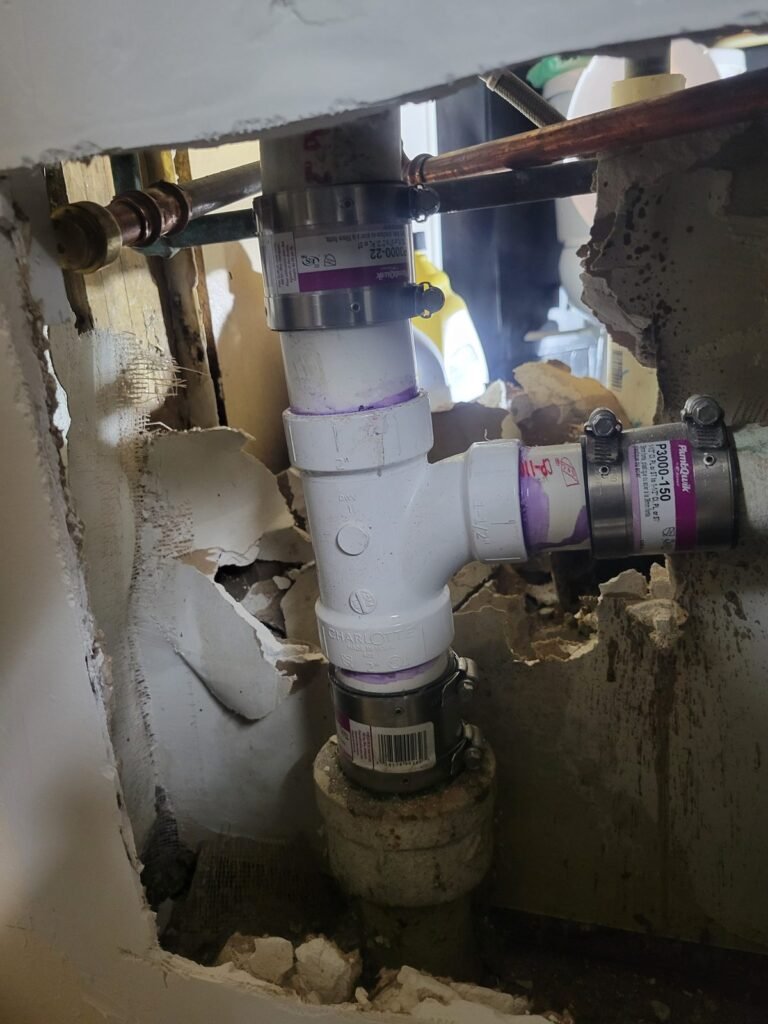New PVC drain stack fittings installed in a wall in College Park, MD