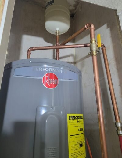 New Rheem Performance electric water heater with expansion tank and copper lines installed in Dunkirk, MD