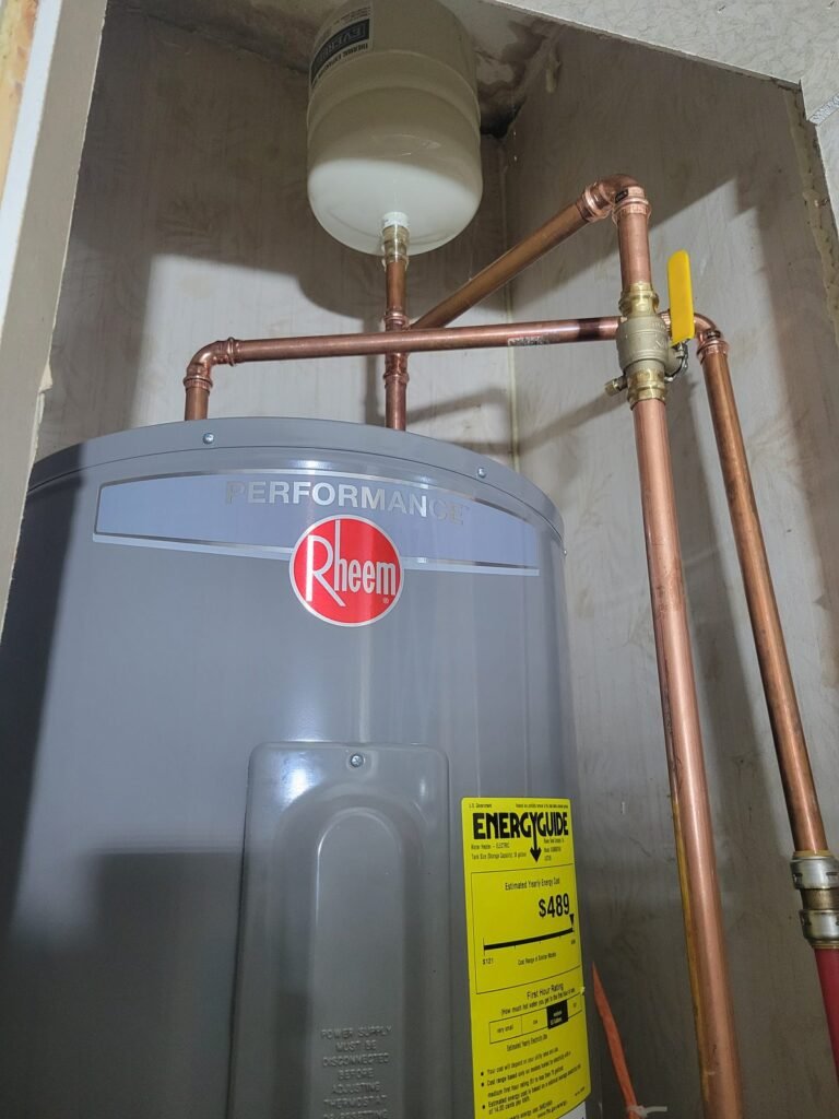 New Rheem Performance electric water heater with expansion tank and copper lines installed in Dunkirk, MD