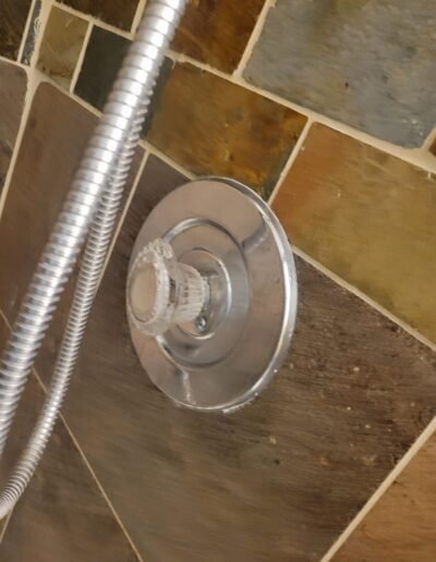 New shower valve trim installed on a tile wall in Bowie, MD
