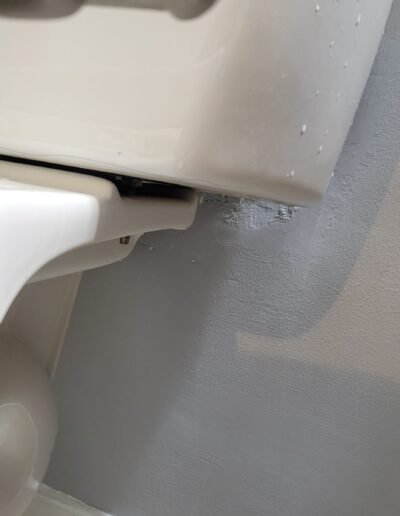 Close-up of toilet base during repair in Glenn Dale, MD