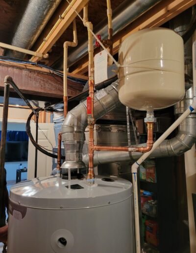 Expansion tank installed above a water heater in Bowie, MD