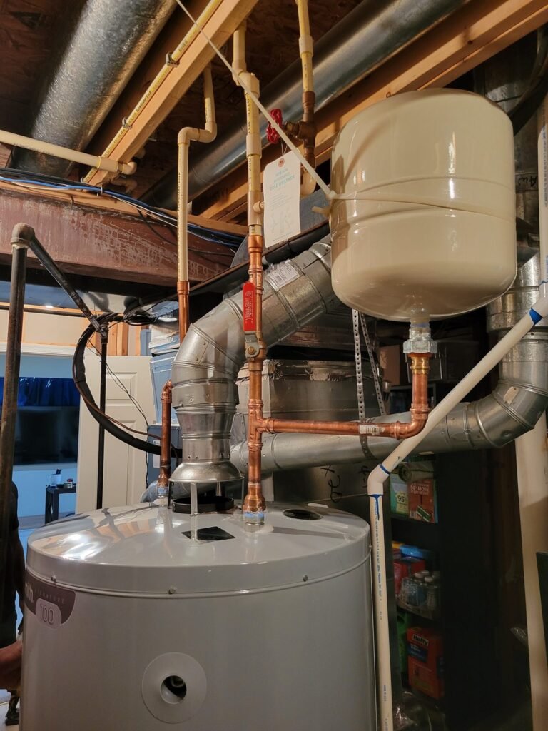 Expansion tank installed above a water heater in Bowie, MD