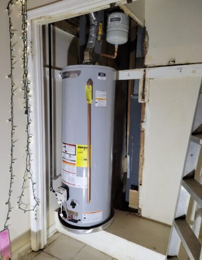 Completed water heater replacement in a utility closet in Baltimore, MD