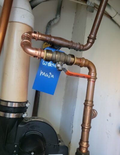 Copper water main piping with labeled shut-off in Washington, DC